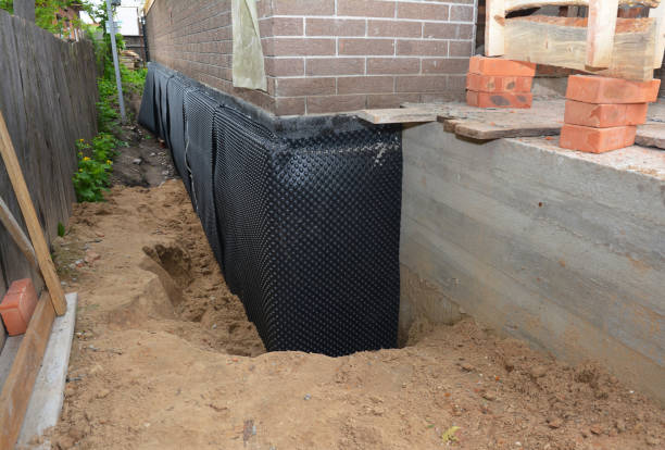 Happy homeowners after waterproofing job in Elberta